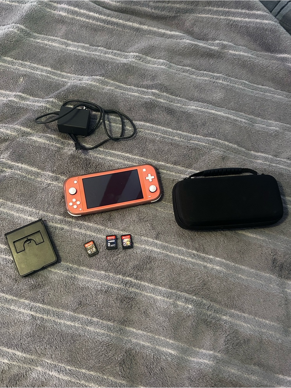 Nintendo Switch Lite Coral Handheld Console with Black Case, Charger, & 3 games
